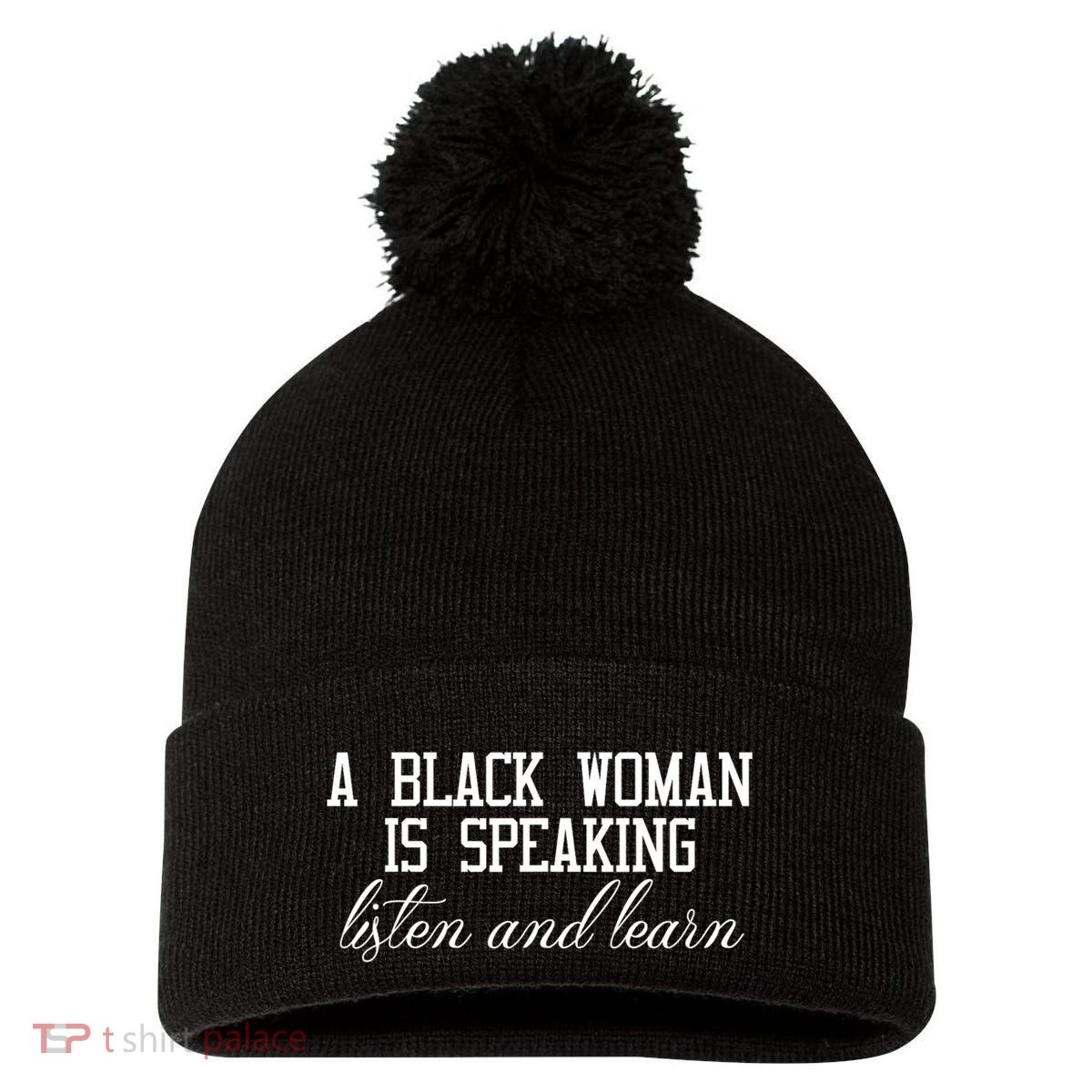 A Black Woman Is Speaking Listen And Learn Pom Pom 12in Knit Beanie