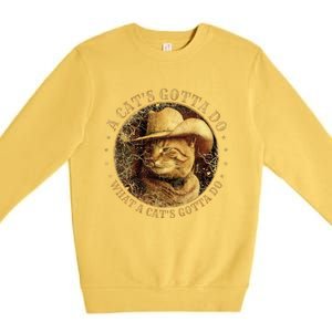 At Cowboy A CatS Gotta Do Funny Cat With Cowboy Hat Premium Crewneck Sweatshirt