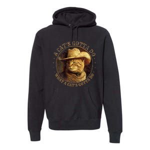 At Cowboy A CatS Gotta Do Funny Cat With Cowboy Hat Premium Hoodie