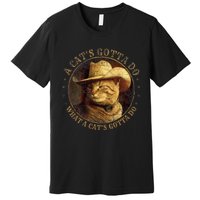 At Cowboy A CatS Gotta Do Funny Cat With Cowboy Hat Premium T-Shirt