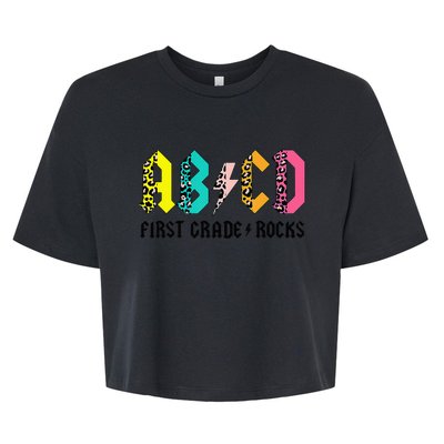 ABCD First Grade Rocks Back To School 1st Grade Teacher Bella+Canvas Jersey Crop Tee