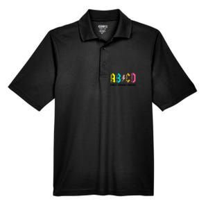 ABCD First Grade Rocks Back To School 1st Grade Teacher Men's Origin Performance Pique Polo