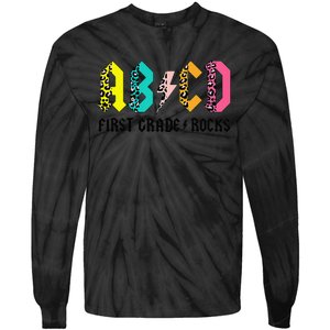 ABCD First Grade Rocks Back To School 1st Grade Teacher Tie-Dye Long Sleeve Shirt