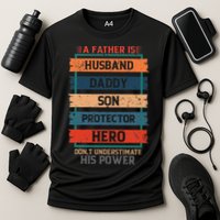 A Father Is Husband Daddy Son Protector Hero Fathers Day Cooling Performance Crew T-Shirt