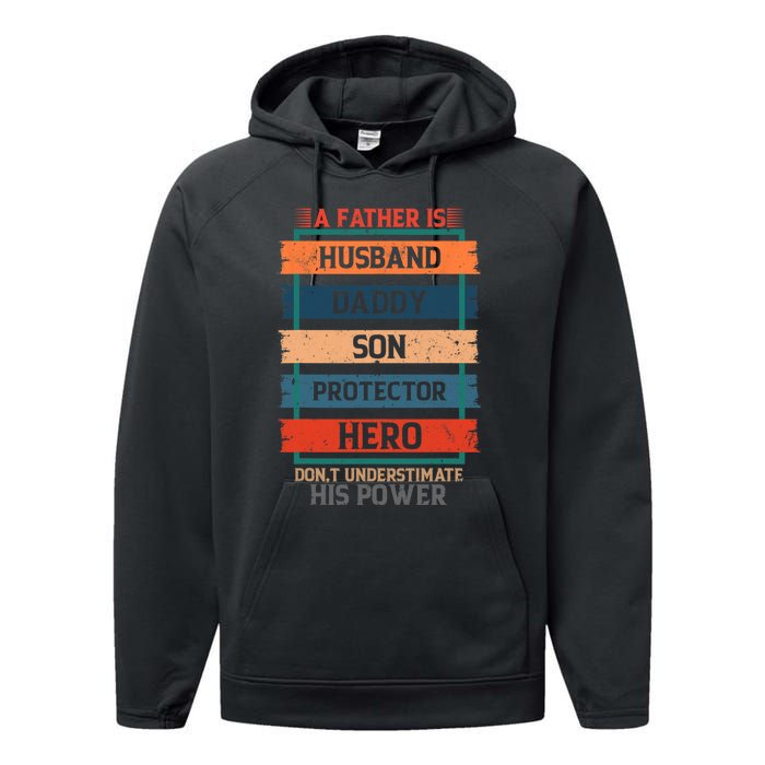 A Father Is Husband Daddy Son Protector Hero Fathers Day Performance Fleece Hoodie