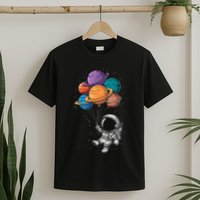 Astronaut Holding Planet Balloons Floating In Space T-Shirt