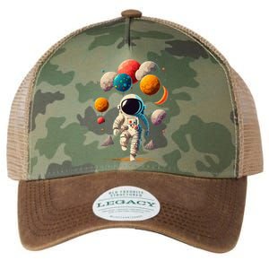 Astronaut Holding Solar System Planets Balloons in Space Legacy Tie Dye Trucker Hat