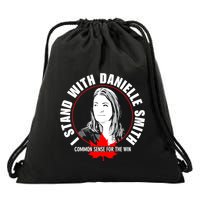 April Hutchinson Wearing I Stand With Danielle Smith Bella Canvas Signature Drawstring Bag