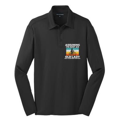 Assuming Im Just An Old Lady Was Your First Mistake Biking Funny Gift Silk Touch Performance Long Sleeve Polo