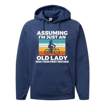 Assuming Im Just An Old Lady Was Your First Mistake Biking Funny Gift Performance Fleece Hoodie