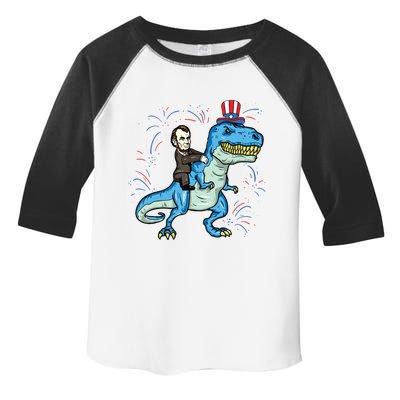 Abe Lincoln Riding A Dinosaur Trex 4th Of July Toddler Fine Jersey T-Shirt