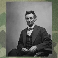 Abraham Lincoln Seated And Holding His Spectacles And A Pencil On Feb 1865 Legacy Tie Dye Trucker Hat