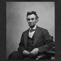 Abraham Lincoln Seated And Holding His Spectacles And A Pencil On Feb 1865 7 Panel Mesh Trucker Snapback Hat