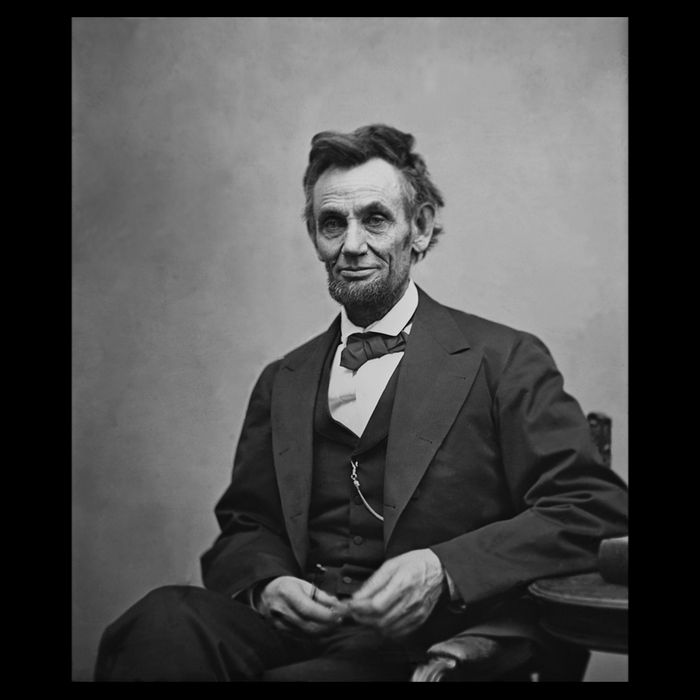 Abraham Lincoln Seated And Holding His Spectacles And A Pencil On Feb 1865 Performance Shirt