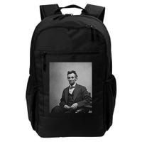 Abraham Lincoln Seated And Holding His Spectacles And A Pencil On Feb 1865 Backpack