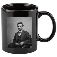 Abraham Lincoln Seated And Holding His Spectacles And A Pencil On Feb 1865 11oz C Handle Ceramic Mug