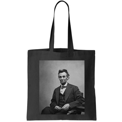 Abraham Lincoln Seated And Holding His Spectacles And A Pencil On Feb 1865 Bag