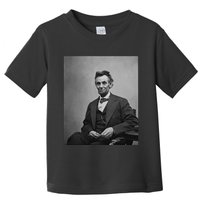 Abraham Lincoln Seated And Holding His Spectacles And A Pencil On Feb 1865 Toddler T-Shirt