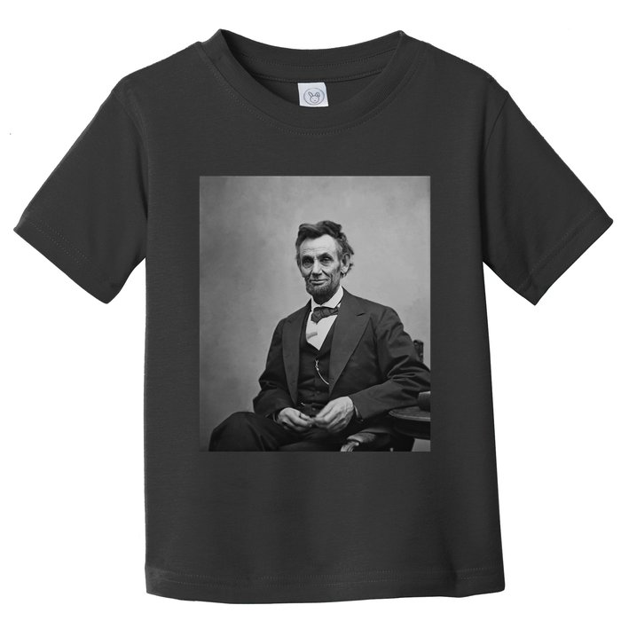 Abraham Lincoln Seated And Holding His Spectacles And A Pencil On Feb 1865 Toddler T-Shirt