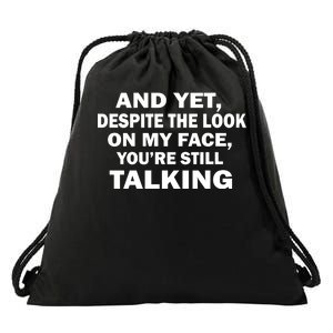 And Yet Despite The Look On My Face You're Still Talking Drawstring Bag