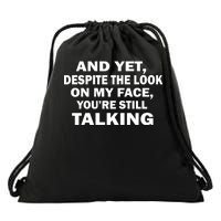 And Yet Despite The Look On My Face You're Still Talking Drawstring Bag