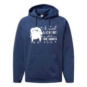 A Real Woman Is Whatever She Wants To Be Performance Fleece Hoodie