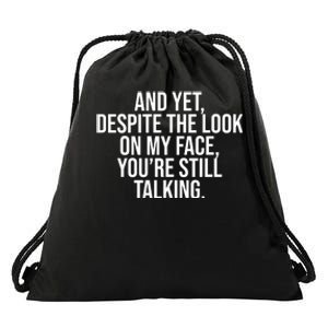 And Yet Despite The Look On My Face YouRe Still Talking Funny Drawstring Bag