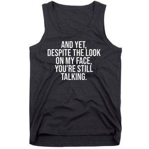 And Yet Despite The Look On My Face YouRe Still Talking Funny Tank Top