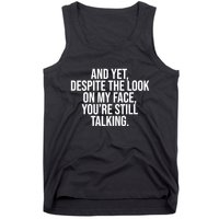 And Yet Despite The Look On My Face YouRe Still Talking Funny Tank Top