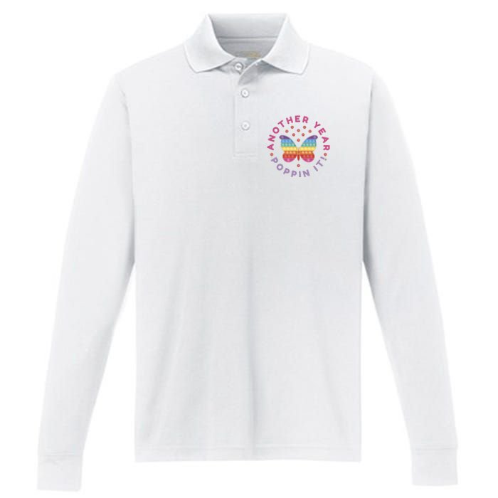 Another Year Poppin It Butterfly Push Pop Performance Long Sleeve Polo