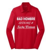 Bad Hombre Seeking A Nasty Woman Silk Touch Performance Long Sleeve Polo