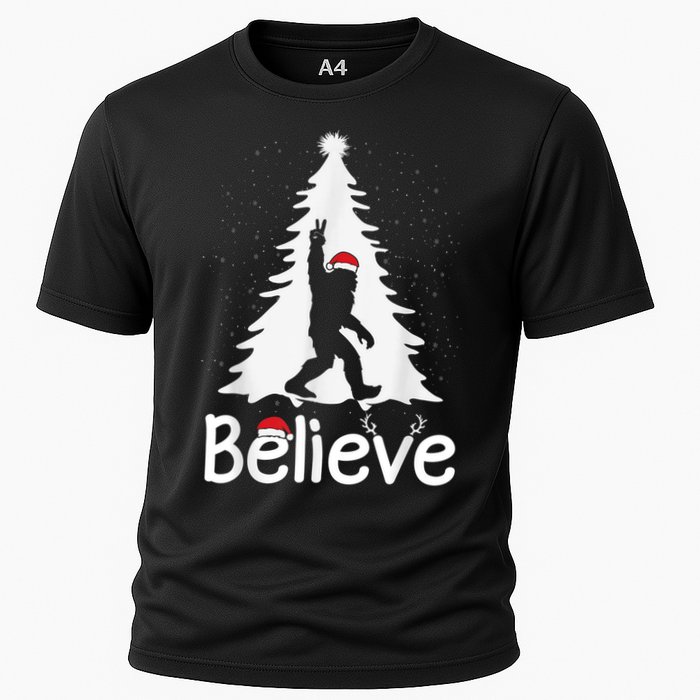 Believe Bigfoot Christmas Yetti Funny Xmas Tree Sasquatch Cooling Performance Crew T-Shirt