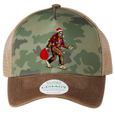 Bigfoot Carrying Christmas Tree Sasquatch Pajama Legacy Tie Dye Trucker Hat
