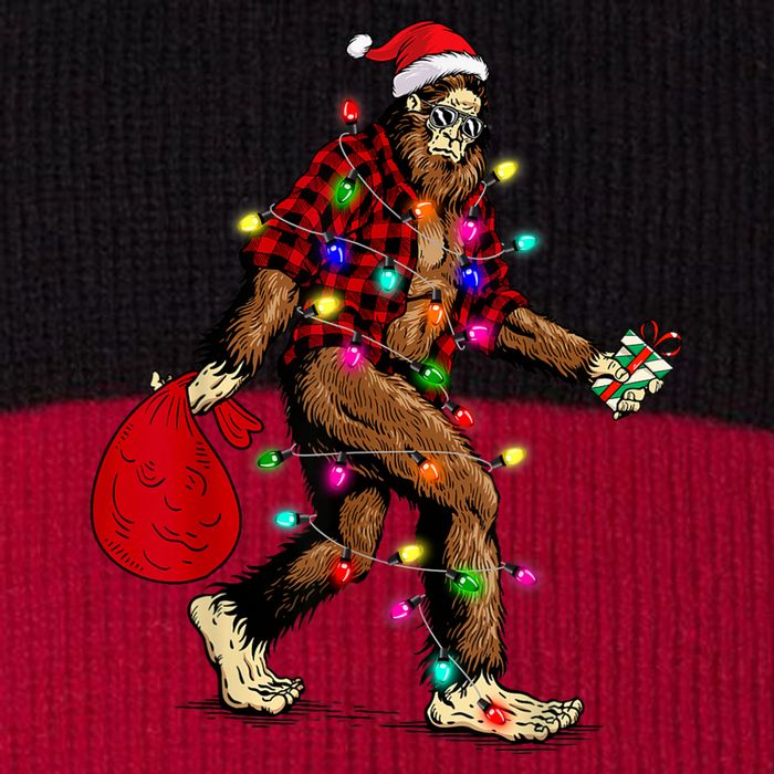 Bigfoot Carrying Christmas Tree Sasquatch Pajama Pom Pom 12in Knit Beanie