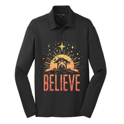 Believe Christmas Religious Nativity Baby Jesus Manger Silk Touch Performance Long Sleeve Polo