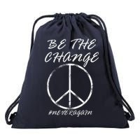 Be The Change Never Again Drawstring Bag