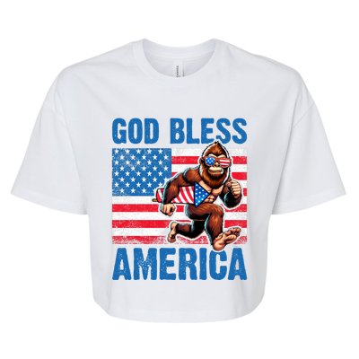 Bigfoot Holding Firework God Bless America Bella+Canvas Jersey Crop Tee