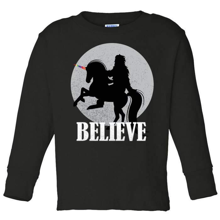 Bigfoot Riding Unicorn Believe Toddler Long Sleeve Shirt