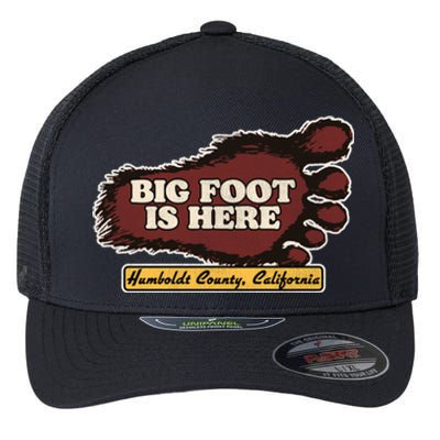 Bigfoot Is Here! Sasquatch Cryptozoology Flexfit Unipanel Trucker Cap