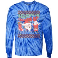 Believe In Magic Of Christmas Groovy Retro Christmas Santa Funny Gift Tie-Dye Long Sleeve Shirt