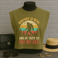 Bigfoot Is Real And He Tried To Eat My Ass Garment-Dyed Women's Muscle Tee
