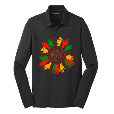 Black History Month Hands Raised  Silk Touch Performance Long Sleeve Polo