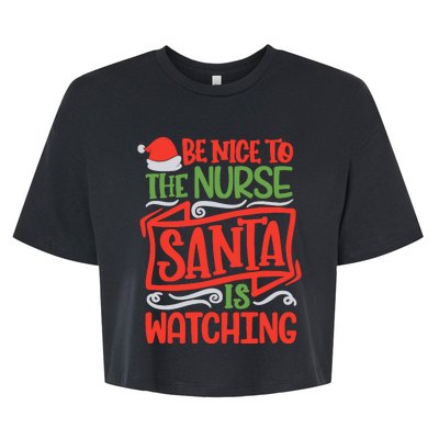 Be Nice To The Nurse Santa Is Watching Nursing Christmas Bella+Canvas Jersey Crop Tee