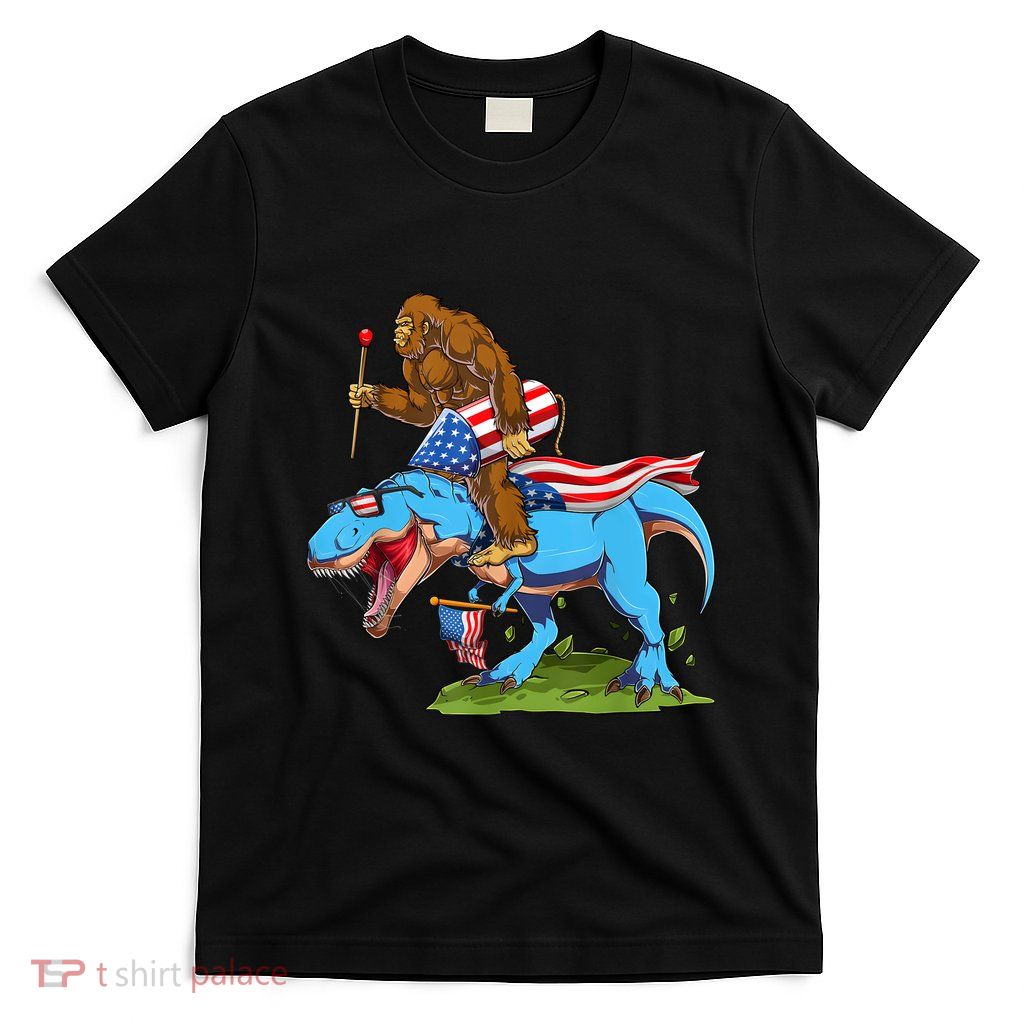 Bigfoot Riding Dinosaur USA Flag 4th Of July America T-Shirt