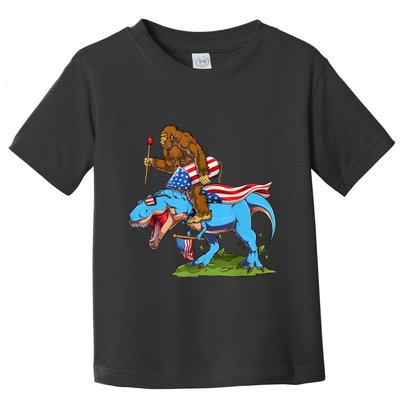 Bigfoot Riding Dinosaur USA Flag 4th Of July America Toddler T-Shirt
