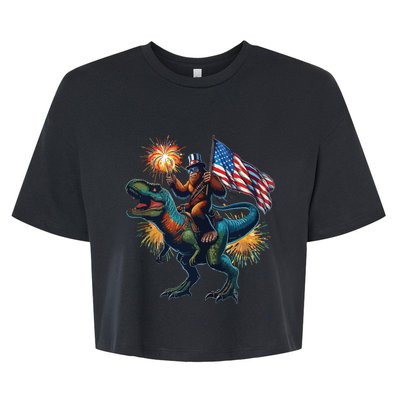 Bigfoot Sasquatch Riding Dinosaur T Rex Funny 4th Of July Bella+Canvas Jersey Crop Tee