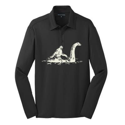 Bigfoot Sasquatch Riding The Loch Ness Monster Silk Touch Performance Long Sleeve Polo