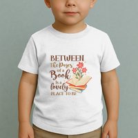 Between The Pages Of A Book Is A Lovely Place To Be Reading Books Toddler T-Shirt