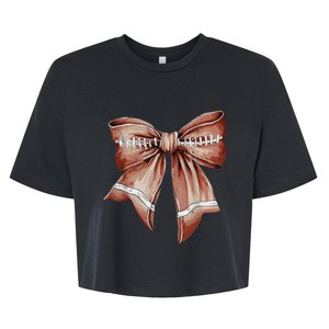 Coquette Bow Funny Football Lover Game Day Football Mom Mama Bella+Canvas Jersey Crop Tee