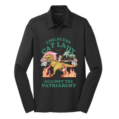 Childless Cat Lady Against The Patriarchy Cat Riding Dino Gift Silk Touch Performance Long Sleeve Polo